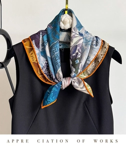 Detailed view of silk-wool scarf with vintage floral prints and bright orange hem edges
