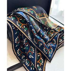 Floral silk wool scarf in navy blue with vintage orange botanical print and washing label