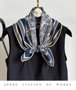 Detail of silk wool scarf showing nautical map print and twill texture on black top