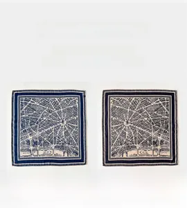 Close-up of silk wool scarf featuring dual-sided vintage city map print and Seines detail