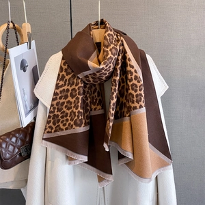 Autumn thick leopard print patchwork scarf with fringes styled on a wool coat