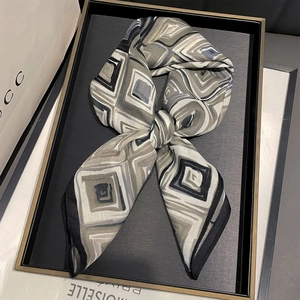 Silk-textured square scarf featuring grey and black geometric diamond patterns in a knot style