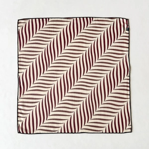 Silk blend square scarf with red and white zigzag patterns and black stitched edges