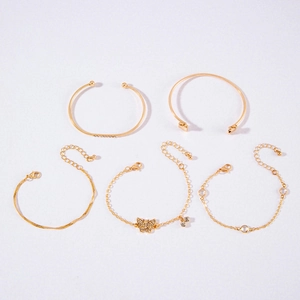 5-piece gold bangle set with twisted metal, faux gems, and butterfly charm pendant