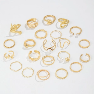 20-piece gold stacking ring set with snake designs, pearls, and minimalist geometric bands