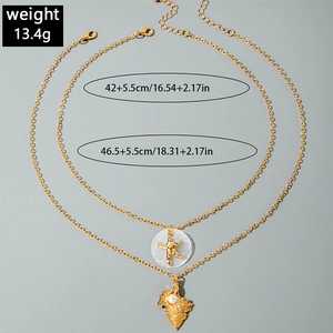 Detail of layered gold necklaces with starfish and shell pendants including dimensions
