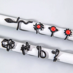 8-piece gothic punk ring set with black metal finish, skull, spider and snake designs