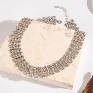 Punk chunky silver mesh collar necklace on marble stone, elegant multi-row bold statement piece