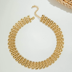 Close-up of golden multi-row interlocking mesh choker necklace with lobster clasp
