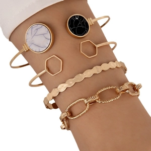 5-piece gold bracelet set with marble textured discs and geometric hollow hexagonal designs