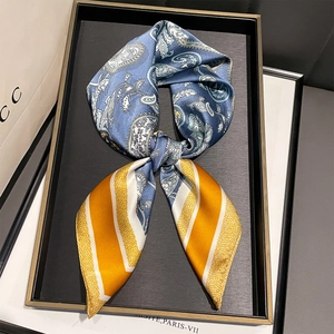 Vintage paisley silk scarf in royal blue and orange stripes on a black tray