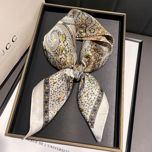 Elegant paisley silk scarf with vintage floral patterns in yellow and green tones