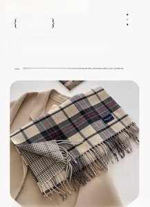 Detail view of khaki plaid scarf with tassels showing 206x54CM size on a coat