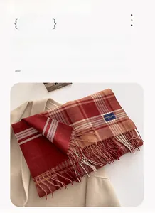 Close-up of red plaid thick cashmere-like scarf with Elegance Classic label, size 206x54cm
