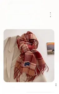 Detail of plaid scarf featuring high thermal fiber and elegant tassel edge design