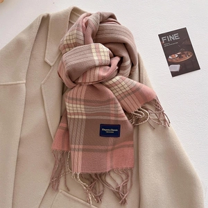Detail of checkered cashmere-feel scarf with tassels and elegant woven label