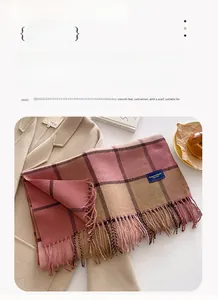 Detail of plaid faux cashmere scarf with tassels, size 206x54cm, cozy winter style