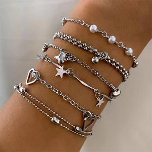 Silver beaded bracelet set with six layered chains featuring pearl star and heart charms
