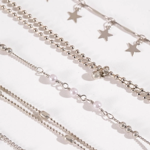 Minimalist six-piece silver beaded bracelet set with star charms and pink pearls