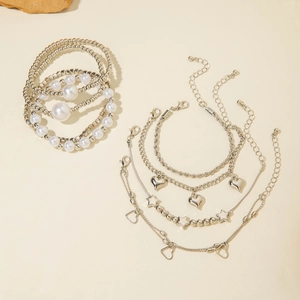 Detailed view of 8-piece silver bohemian bracelet set with heart and star charms