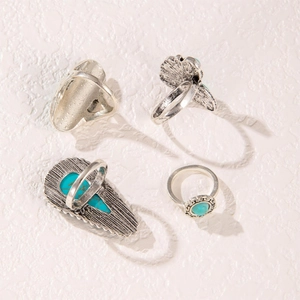 Vintage silver bohemian ring set with turquoise stones and floral geometric carvings