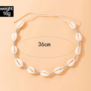 Detail of seashell and silver bead necklace with 36cm length and 16g weight specs