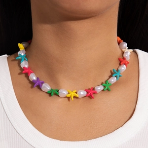 Detail of colorful starfish beads and white pearls on a bohemian beach necklace