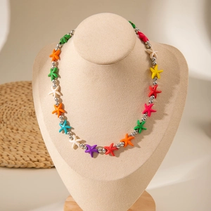 Detailed close-up of colorful starfish charms on a silver beaded Bohemian beach necklace