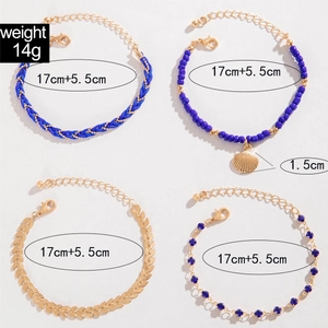 Detail view of four-piece bohemian bracelet set with shell charm and bead weaving