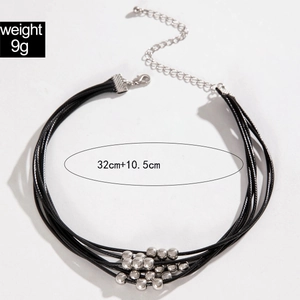 Detail of multi-layer black cord choker with silver beads and lobster clasp closure