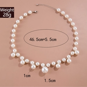 Detail of beaded pearl necklace with 1cm and 1.5cm charms and silver-plated hardware