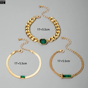 Three-piece gold layered bracelet set with emerald green stones and lobster clasp