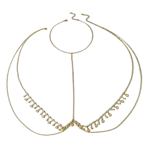 Gold multi-layer body chain with emerald-style rhinestones and shell pendants on white background