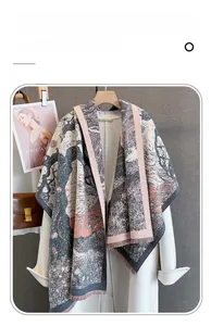 Detail of landscape art print cashmere-feel scarf with fine fringe on a wooden hanger