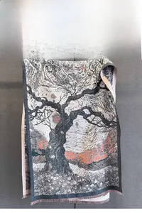 Detail of jacquard scarf with ancient tree landscape pattern and delicate fringe edges