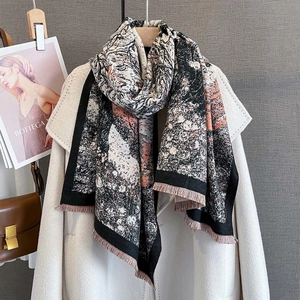 Autumn warm jacquard scarf with abstract orange and black print and fringe details