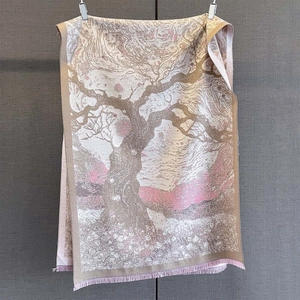 Detail of vintage floral jacquard scarf featuring pink tree pattern and fine tassels