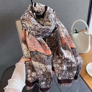 Thick autumn tiger print scarf in warm brown and orange tones with tassel edges