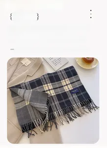 Detailed view of plaid scarf with tassels on wool coat, measuring 206 by 54 cm