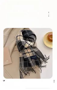 Detail showing the thick plaid tassel scarf with high thermal fiber for winter warmth