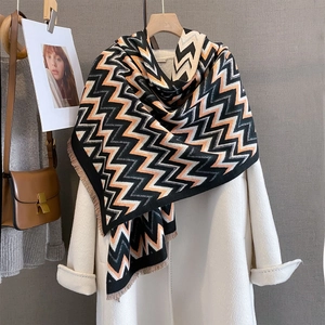 Thick autumn pashmina scarf with orange geometric wave patterns and fringe detail