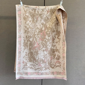 Detail of vintage flower and bird print on cashmere-like scarf with soft pink fringe