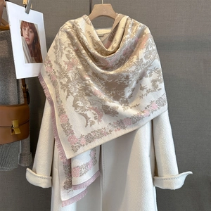 Vintage floral bird print beige cashmere-feel scarf with tassels over a white coat