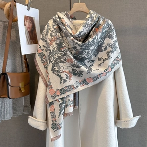 Close-up of floral jacquard pattern and tassel edges on thick pashmina shawl