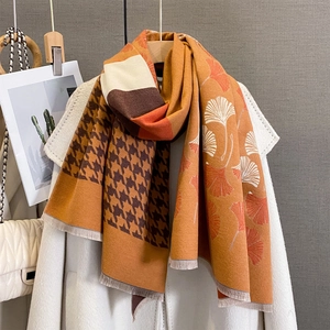 Cashmere-like scarf with ginkgo leaf and houndstooth pattern in warm autumn tones