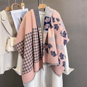 Detail of pink and grey cashmere-like scarf with houndstooth and ginkgo leaf pattern