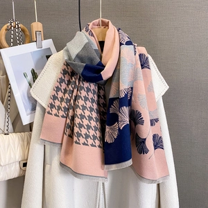 Detail of cashmere-like scarf with ginkgo leaf patterns and houndstooth fringe edge