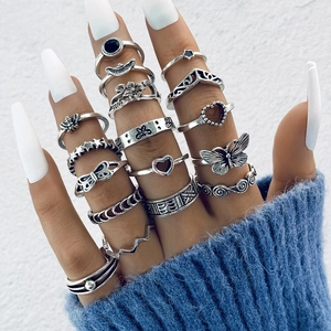 Detailed view of 15 pieces vintage silver rings with butterfly and floral engravings