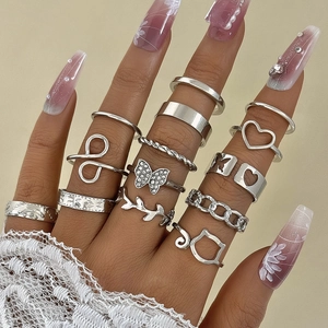 Detail of 13-piece vintage silver ring set with butterfly, heart and cat motifs