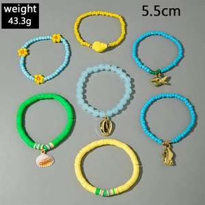 Detail view of 7-piece bohemian beaded bracelet set with seashell charms weight 43.3g